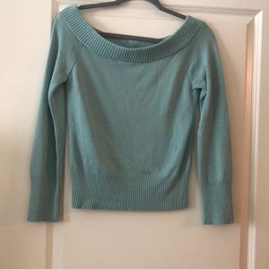 Women’s blue-green sweater.